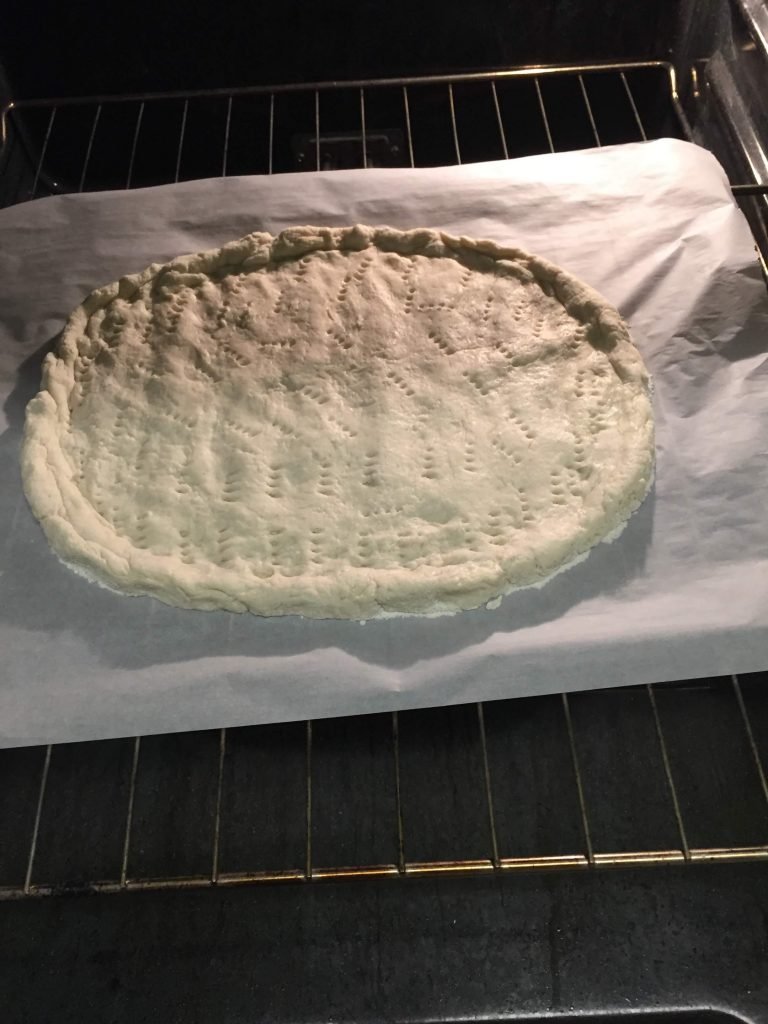 Prebake the pizza crust on parchment paper directly on the oven rack