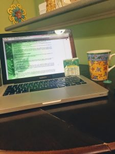 laptop with tea cup